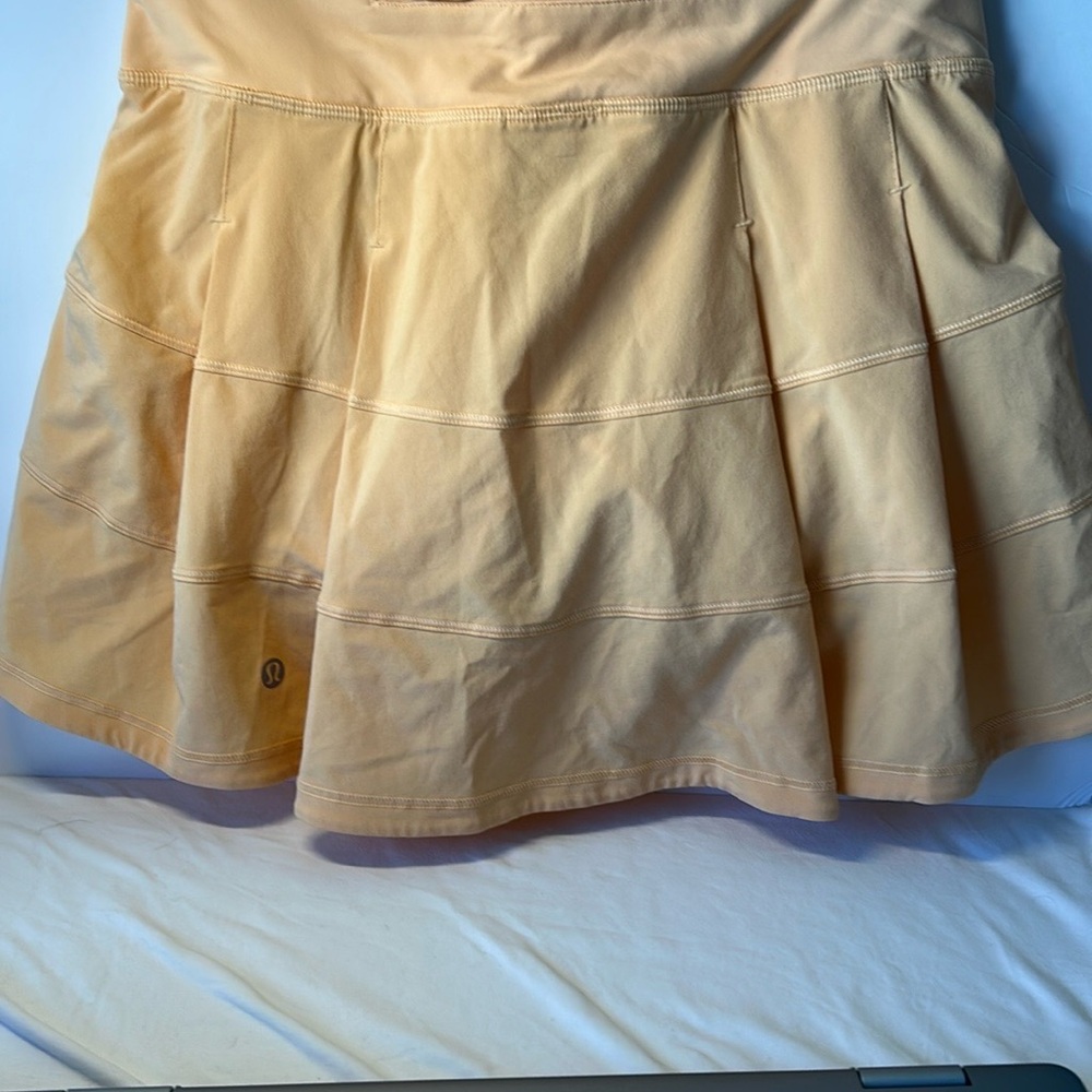 lululemon athletica skirt light orange peach color. Back zipper pocket